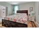 Main bedroom with king-size bed, wood framed bed, and patterned rug at 407 Douglas St, New Smyrna Beach, FL 32168