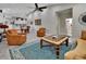 Open living room with comfortable seating and views to kitchen at 407 Douglas St, New Smyrna Beach, FL 32168