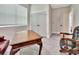 Bright home office with a wooden desk and two chairs at 407 Douglas St, New Smyrna Beach, FL 32168