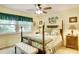 Main bedroom with a post bed, a view and lots of natural light at 2051 Cornell Pl, Port Orange, FL 32128