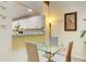Bright dining area with glass table and seating for four at 2051 Cornell Pl, Port Orange, FL 32128