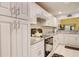 Modern kitchen with white cabinets and granite countertops at 2051 Cornell Pl, Port Orange, FL 32128