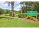 Overlook Park entrance with lush greenery and pond at 2051 Cornell Pl, Port Orange, FL 32128