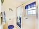 Bathroom with shower/tub combo, updated vanity, and window at 2051 Cornell Pl, Port Orange, FL 32128
