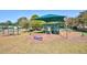 playground with swings, slides and shade structure at 2051 Cornell Pl, Port Orange, FL 32128