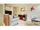 Home office with built-in shelving, comfortable seating, and a workspace at 2051 Cornell Pl, Port Orange, FL 32128