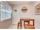 Charming kitchen breakfast nook with wood table and cushioned chairs at 2051 Cornell Pl, Port Orange, FL 32128
