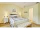 Main bedroom with white furniture and en-suite bathroom access at 2051 Cornell Pl, Port Orange, FL 32128