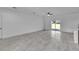 Spacious living room with tile floors and sliding glass doors at 15190 Cr-565A, Clermont, FL 34711