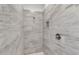 Walk-in shower with grey marble-look tiles at 15190 Cr-565A, Clermont, FL 34711