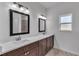 Double sink bathroom with dark brown cabinets and quartz countertops at 15190 Cr-565A, Clermont, FL 34711