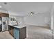 Open living room with tile flooring and access to the kitchen at 15190 Cr-565A, Clermont, FL 34711