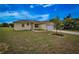 A tan house with a two-car garage and a neatly landscaped yard at 15190 Cr-565A, Clermont, FL 34711