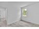 Bright bedroom with window and access to another room at 15190 Cr-565A, Clermont, FL 34711
