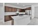 Spacious kitchen featuring dark brown cabinets and a large island at 15190 Cr-565A, Clermont, FL 34711