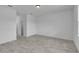Bright bedroom with tile flooring and access to hallway at 15190 Cr-565A, Clermont, FL 34711