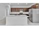 Modern kitchen with stainless steel appliances and a large island at 15190 Cr-565A, Clermont, FL 34711