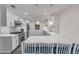 Modern kitchen with white cabinets, quartz countertops, and island at 40 Oak Tree Dr, New Smyrna Beach, FL 32169