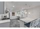 Modern kitchen with white cabinets, quartz countertops, and stainless steel appliances at 40 Oak Tree Dr, New Smyrna Beach, FL 32169