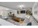 Spacious living room with L-shaped sofa and built-in shelving at 40 Oak Tree Dr, New Smyrna Beach, FL 32169