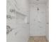 Spa-like bathroom with marble tile, rainfall shower head, and multiple shower jets at 40 Oak Tree Dr, New Smyrna Beach, FL 32169