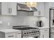 Stylish kitchen with gas range and modern backsplash at 40 Oak Tree Dr, New Smyrna Beach, FL 32169