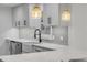 Modern kitchen with white cabinets and a farmhouse sink at 40 Oak Tree Dr, New Smyrna Beach, FL 32169
