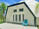 View of home's exterior with patio and blue chair at 624 Volco Rd, Edgewater, FL 32141