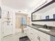 Double vanity bathroom with granite countertop and bathtub at 624 Volco Rd, Edgewater, FL 32141