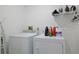 Laundry room with washer, dryer, and shelving for storage at 1319 Orange Tree Dr, Edgewater, FL 32132