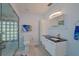 Modern bathroom with a walk-in shower, toilet and floating vanity at 1319 Orange Tree Dr, Edgewater, FL 32132