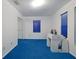 Bedroom with blue carpet and mirrored closet doors at 1319 Orange Tree Dr, Edgewater, FL 32132
