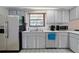 Bright kitchen with stainless steel appliances and ample counter space at 1319 Orange Tree Dr, Edgewater, FL 32132