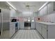 Open concept kitchen with stainless steel appliances and a large island at 1319 Orange Tree Dr, Edgewater, FL 32132