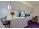 Kitchen boasts a breakfast bar, modern appliances, and an open layout at 1319 Orange Tree Dr, Edgewater, FL 32132