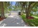 House exterior showcasing a driveway and mature trees at 1319 Orange Tree Dr, Edgewater, FL 32132