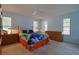 Bright bedroom with hardwood floors and plenty of natural light at 1319 Orange Tree Dr, Edgewater, FL 32132
