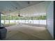 Spacious screened porch with ceiling fan and backyard access at 1319 Orange Tree Dr, Edgewater, FL 32132
