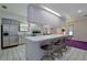 Modern kitchen with a large island and breakfast bar, stainless steel appliances at 1319 Orange Tree Dr, Edgewater, FL 32132