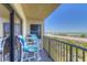 Balcony with ocean views and outdoor seating at 3180 Ocean Shore Blvd # 208, Ormond Beach, FL 32176