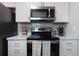 Modern kitchen with stainless steel appliances and marble countertops at 3750 S Atlantic Ave # 180, Daytona Beach Shores, FL 32118