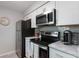 Updated kitchen featuring stainless steel appliances and marble countertops at 3750 S Atlantic Ave # 180, Daytona Beach Shores, FL 32118