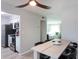Open kitchen with stainless steel appliances and view of dining area at 3750 S Atlantic Ave # 180, Daytona Beach Shores, FL 32118