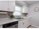 Modern kitchen with white cabinets, marble countertops, and stainless steel appliances at 3750 S Atlantic Ave # 180, Daytona Beach Shores, FL 32118