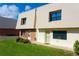 Two-story condo building with a green lawn at 3750 S Atlantic Ave # 180, Daytona Beach Shores, FL 32118