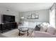 Bright living room featuring a large sectional sofa and flat-screen TV at 3750 S Atlantic Ave # 180, Daytona Beach Shores, FL 32118