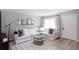 Spacious living room with white sectional sofa and modern decor at 3750 S Atlantic Ave # 180, Daytona Beach Shores, FL 32118