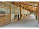 Multiple horse stalls with wood construction and metal accents at 3650 Pepper Ln, New Smyrna Beach, FL 32168