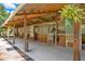 Covered stalls with concrete flooring and ceiling fans at 3650 Pepper Ln, New Smyrna Beach, FL 32168