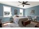 Bedroom with two chairs and a ceiling fan at 3650 Pepper Ln, New Smyrna Beach, FL 32168